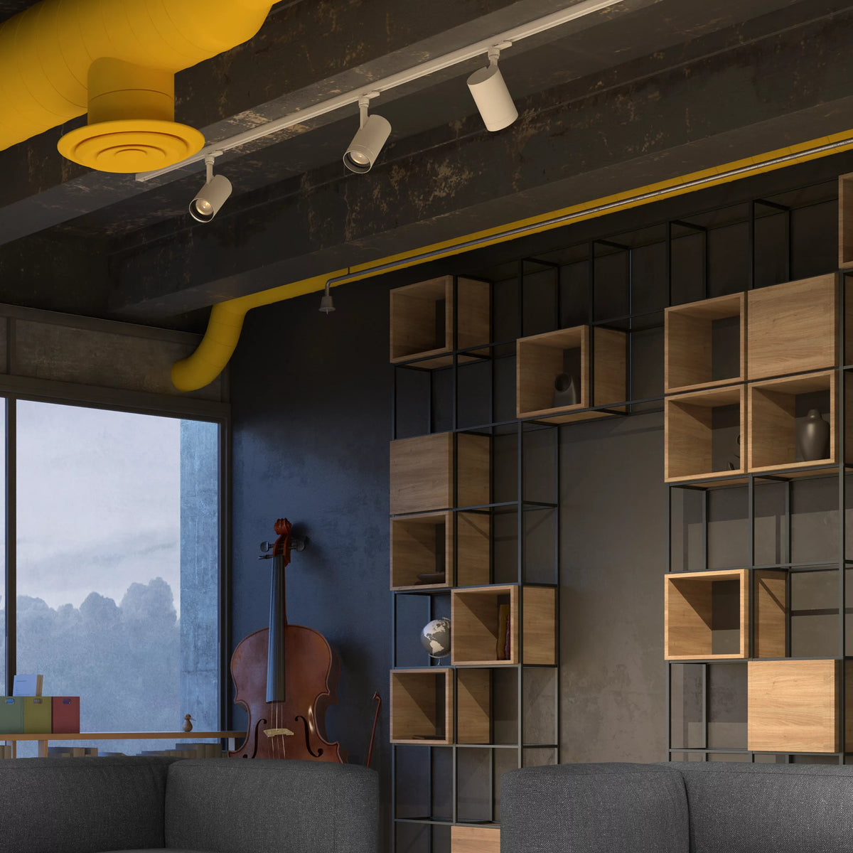 Track spotlights beside a yellow air duct in a loft with a cello and grey sofas