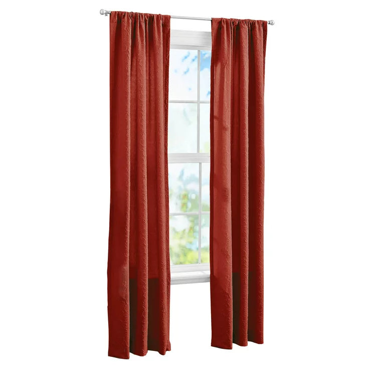 Pair of rust red curtain panels hung on a rod, cut out on white