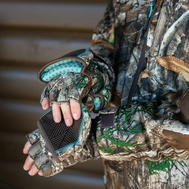 Hands in camo fingerless gloves with teal-lined mitten flaps folded back