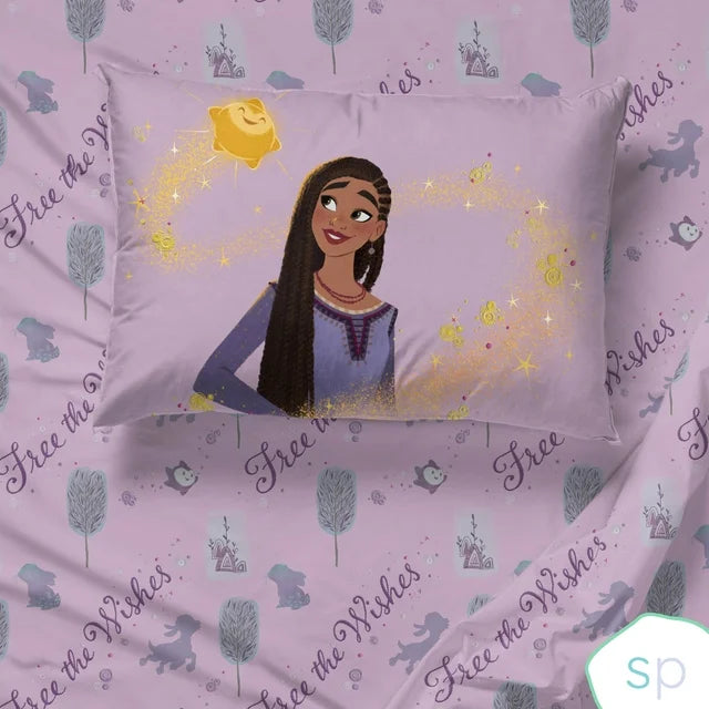 Close-up of the Asha and star pillowcase on the lilac print sheet