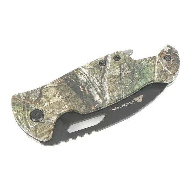 Camo folding knife closed, blade tucked into the tree camo handle