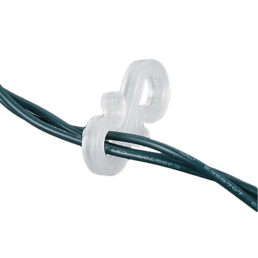 Clear plastic hook gripping a twisted green light string wire