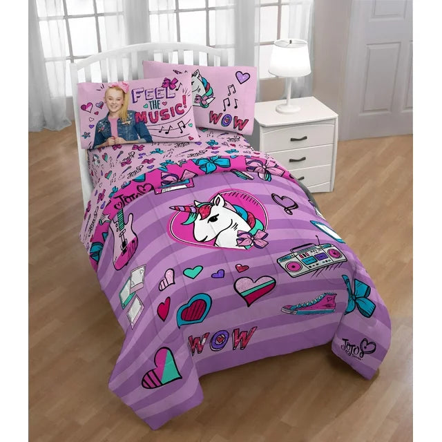 Comforter set on a bed with a Feel the Music pillowcase