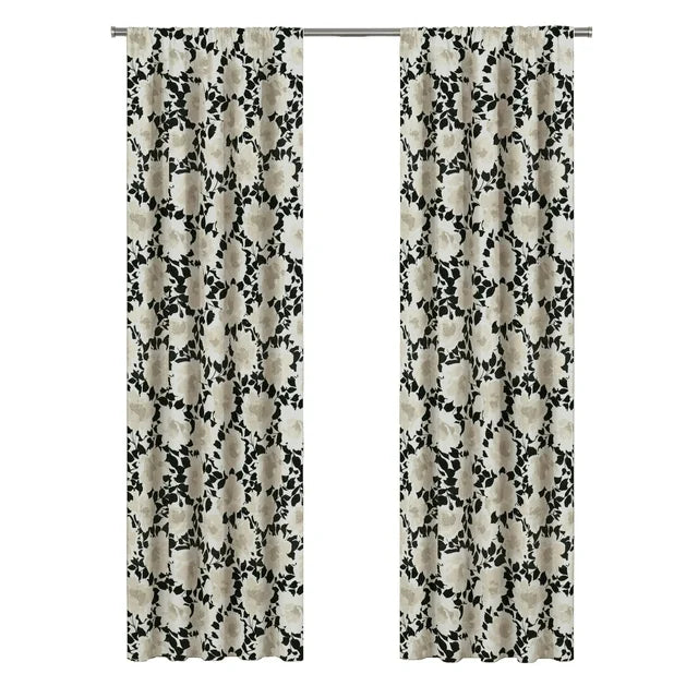 Pair of black and cream floral panels on a rod, white background