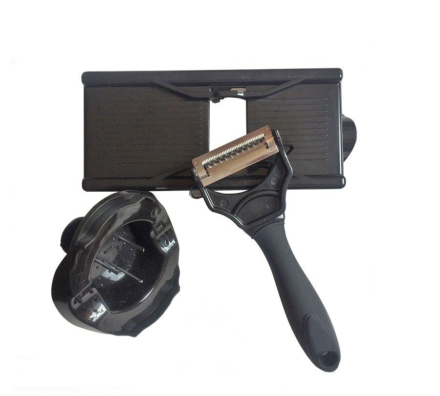 Black slicer frame, julienne peeler and round grater cup laid out unpacked