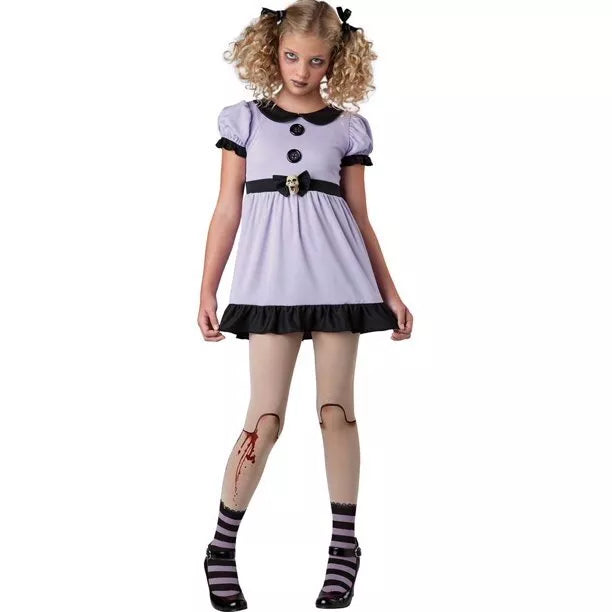 Girl in a lilac doll dress with black collar, cracked-leg print tights and striped socks