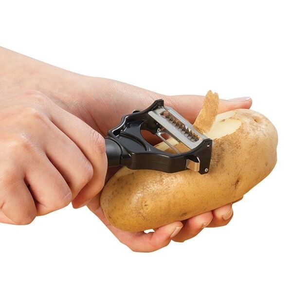 Hands peeling a potato with the black dual-blade peeler