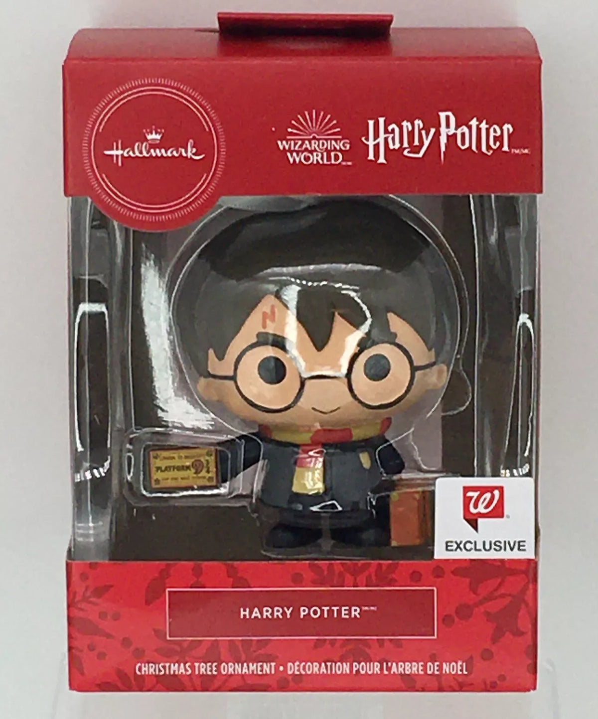 Boxed chibi wizard boy ornament with round glasses, striped scarf, train ticket and trunk