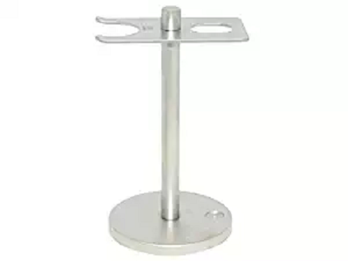 Brushed stainless steel stand with forked top holding slots for a razor and brush