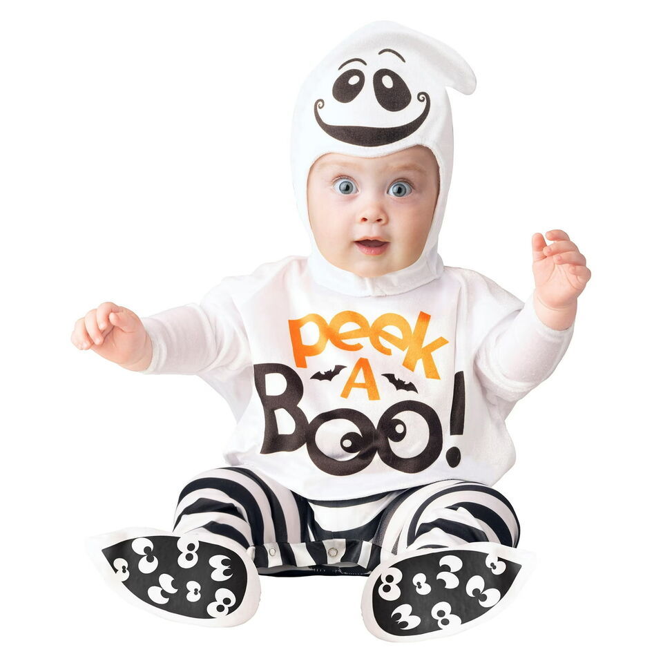 Baby in a white ghost hood and Peek A Boo jumpsuit with black and white striped legs