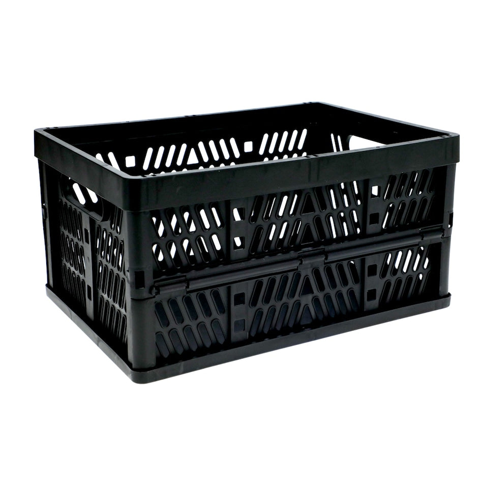 Black collapsible plastic crate opened up, with slotted sides and hand holes