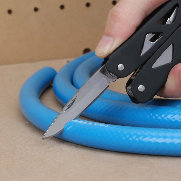 Black multi-tool knife blade slicing a blue rubber hose