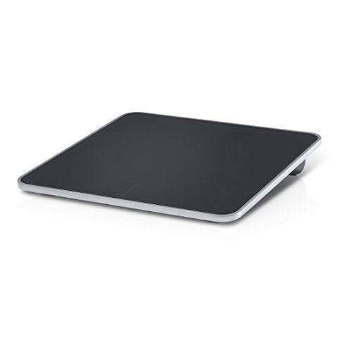 Black and silver wireless touchpad at an angle