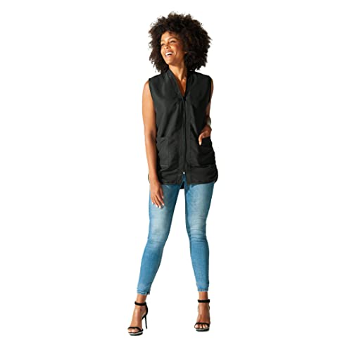 Laughing woman with a hand in the pocket of the black stylist vest