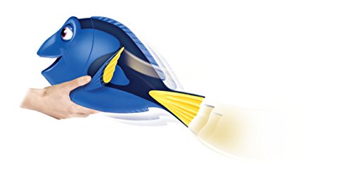 Hand holding the My Friend Dory toy as her tail swishes side to side