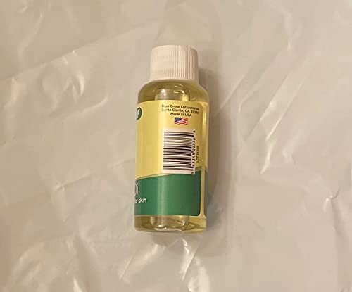 Side of the vitamin E oil bottle showing the barcode and made in USA label