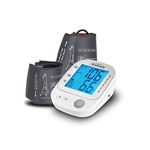 White upper arm blood pressure monitor with blue backlit screen and two grey cuffs