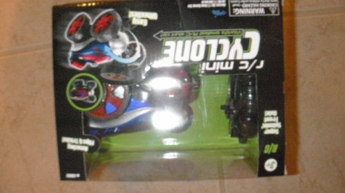 Boxed red and blue mini RC stunt car, photo upside down with flash glare
