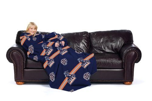 Woman on a leather sofa wrapped in a navy and orange UTEP Miners sleeved throw