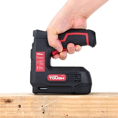 Hand pressing the black and red staple gun down onto a wood board