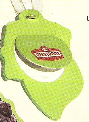 Back of a green dog head luggage tag with a flip-up address card