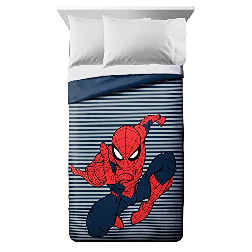 Spider-Man leaping across a navy and grey striped comforter
