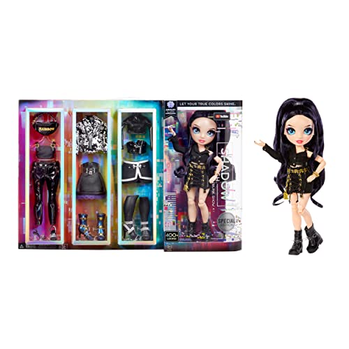 Fashion doll with long purple-black hair beside her box of three black outfits
