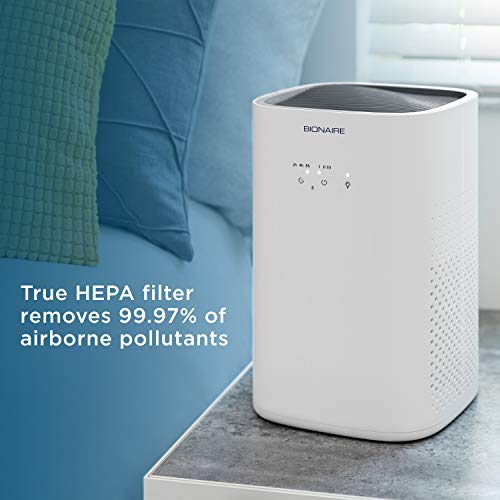 Air purifier on a side table: true HEPA filter removes 99.97% of pollutants
