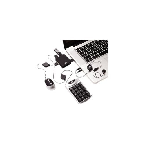 Number pad, mouse, USB hub and retractable cables set up around a laptop