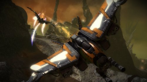 Orange and grey fighter jet flying low through a rocky canyon