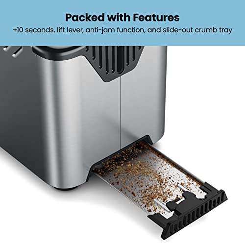 Slide-out crumb tray full of crumbs pulled from the base of the toaster