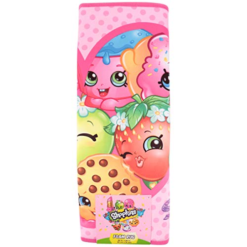 Rolled pink Shopkins foam rug with Kooky Cookie and Strawberry Kiss and its label