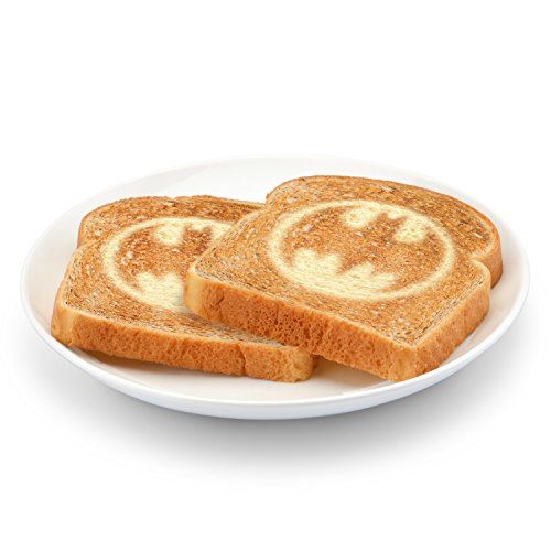 Two slices of toast with the bat symbol browned in on a white plate