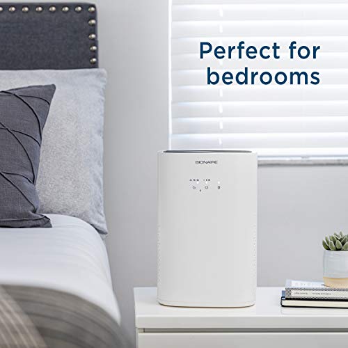 White air purifier on a bedside nightstand: perfect for bedrooms