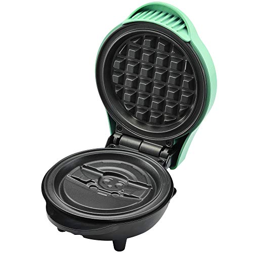 Open mini waffle maker showing the grid top plate and Grogu lower plate