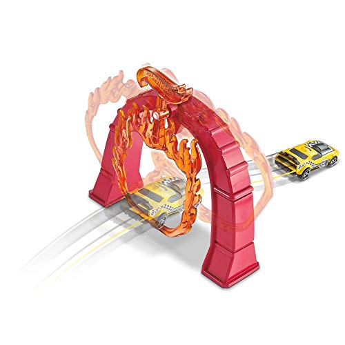 Yellow taxi car jumping through the orange flame ring on a red arch