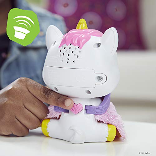 Finger pressing the heart button on the back of the Airina unicorn toy