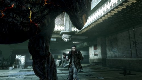 Hero facing a huge creature in a tiled subway station