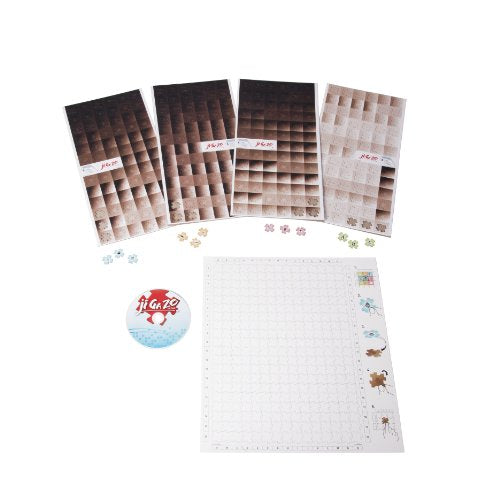 Ji Ga Zo puzzle contents laid out with piece sheets, CD and grid board