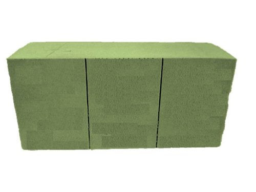 Green wet floral foam brick scored into three sections