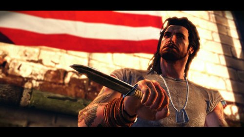 Long-haired biker with dog tags holding a knife before a flag