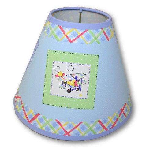 Blue nursery lamp shade with plaid trim and a green patch of a biplane