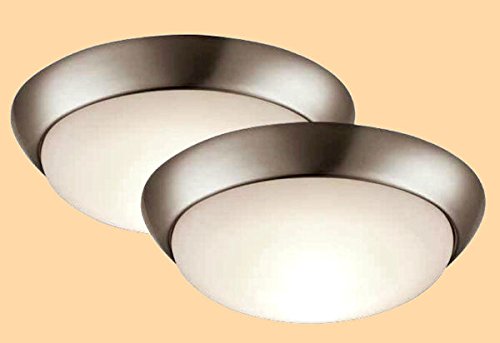 Two brushed nickel flush mount ceiling lights with white frosted glass