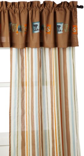 Striped curtain panel below a brown valance with X Games patches