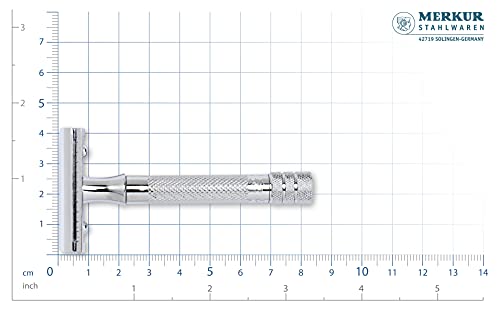 Chrome safety razor on a measuring grid, about 9.5 cm long