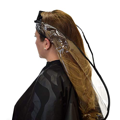 Woman seated upright wearing a clear vinyl hair washing funnel over a cape