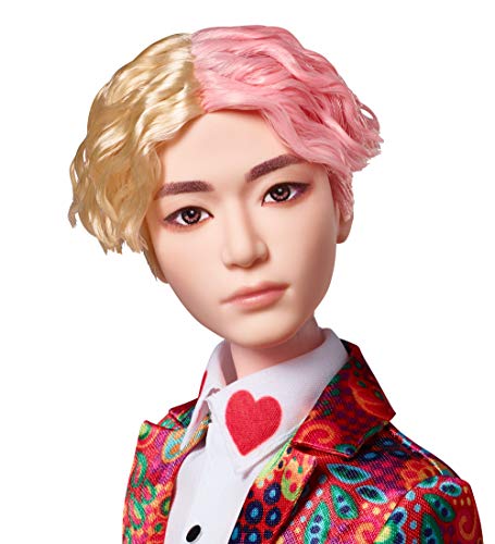Close-up of the BTS V doll face with blond and pink hair, looking straight ahead