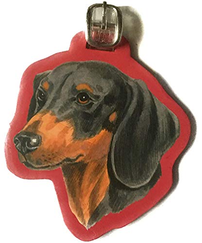 Black and tan dachshund head luggage tag with a red edge and buckle strap