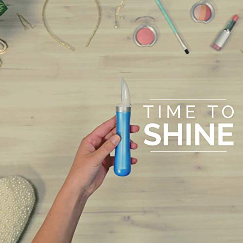 Hand holding the blue Amope nail tool over a vanity with makeup, Time to Shine