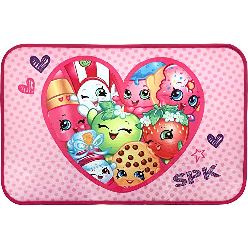 Pink polka dot Shopkins bath mat with characters inside a big heart